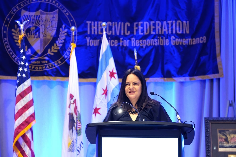 Cynthia Yazdi, senior vice president of communications and brand at Motorola Solutions, announces Annette Nance-Holt as the 31st Annual Excellence in Public Service Award recipient.